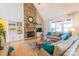 Cozy living room with a stone fireplace, built-in shelving, and large windows at 258 Ridge Reserve Dr, Lake Wylie, SC 29710