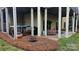 Covered patio with hot tub, grill, and outdoor seating area at 258 Ridge Reserve Dr, Lake Wylie, SC 29710