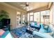 Relaxing screened-in porch with comfortable seating, ceiling fan, and outdoor views at 258 Ridge Reserve Dr, Lake Wylie, SC 29710