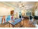 Large recreation room with a bar, ping pong table and multi-colored stools at 258 Ridge Reserve Dr, Lake Wylie, SC 29710