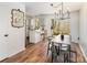 Dining area with access to a deck, featuring modern lighting and a breakfast bar, perfect for casual dining and gatherings at 3428 Braewick Pl, Charlotte, NC 28227