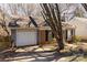 View of a one-story home featuring a brick facade, attached garage, and well-kept landscaping at 3428 Braewick Pl, Charlotte, NC 28227