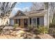 Charming home exterior featuring brick accents, gray siding, and well-maintained landscaping, creating inviting curb appeal at 3428 Braewick Pl, Charlotte, NC 28227