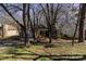 Charming home featuring mature trees, cozy front yard and attached garage at 3428 Braewick Pl, Charlotte, NC 28227