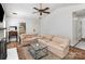 Inviting living space featuring plush sofas, a glass coffee table, and ample natural light, perfect for relaxing and entertaining at 3428 Braewick Pl, Charlotte, NC 28227