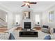 Cozy living room with fireplace, hardwood floors, and lots of natural light at 416 Eli St, Charlotte, NC 28204