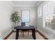 Cozy home office with a dark wood desk, shuttered window, and a calming neutral color palette at 416 Eli St, Charlotte, NC 28204