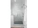 Modern shower with a glass enclosure, rainfall showerhead, and stylish tile work at 4207 Walker Rd, Charlotte, NC 28211