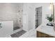 Bright bathroom with a glass-enclosed shower, double vanity, and stylish tile flooring at 4207 Walker Rd, Charlotte, NC 28211