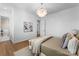 Bright bedroom showcasing a cozy bed, natural light, and minimalist decor, creating a serene space at 4207 Walker Rd, Charlotte, NC 28211