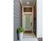 Stylish front door entrance with modern details, and decorative plants at 4207 Walker Rd, Charlotte, NC 28211