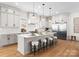 Bright kitchen with stainless steel appliances, quartz countertops, and a large island at 4207 Walker Rd, Charlotte, NC 28211