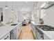 Modern kitchen featuring a large island, open to the dining area with hardwood floors at 4207 Walker Rd, Charlotte, NC 28211