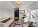 Bright living room with stylish sofas, glass table, a bar area and seamless access to the outdoor patio at 4207 Walker Rd, Charlotte, NC 28211