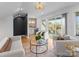 Inviting living room with plush seating, glass coffee table, and a seamless transition to an outdoor balcony at 4207 Walker Rd, Charlotte, NC 28211