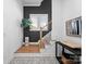 Elegant staircase with contrasting dark wall, hardwood steps, and modern railing, adding architectural detail at 4207 Walker Rd, Charlotte, NC 28211