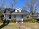 A charming single-story home with a dormer window and a brick chimney needing a little TLC at 437 & 437 1/2 Hope St, Rock Hill, SC 29730