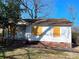 Single-story home showing boarded-up windows, brick foundation, covered porch, and some deferred maintenance at 437 & 437 1/2 Hope St, Rock Hill, SC 29730