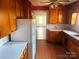 Functional kitchen featuring light countertops, white refrigerator, wood cabinets at 437 & 437 1/2 Hope St, Rock Hill, SC 29730