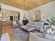 Bright living room featuring a wood ceiling, hardwood floors, and comfortable seating at 500 Chillingworth Ln, Charlotte, NC 28211