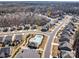 Community aerial view showing a pool, clubhouse and lush landscaping within a neighborhood close to a forest at 5050 Watersail Way, Lake Wylie, SC 29710