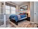 Cozy bedroom with a queen-size bed, plush rug, and large window at 5050 Watersail Way, Lake Wylie, SC 29710