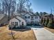 Two story home with stone accents, covered porch, and well-kept lawn and landscaping at 5050 Watersail Way, Lake Wylie, SC 29710