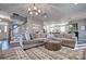 Spacious living room featuring a sectional sofa, neutral tones, and open floor plan at 5050 Watersail Way, Lake Wylie, SC 29710
