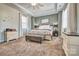 Large main bedroom features a trey ceiling, a ceiling fan, and a sitting bench at 5050 Watersail Way, Lake Wylie, SC 29710