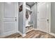 Mudroom features built-in bench and shelving with storage baskets at 5050 Watersail Way, Lake Wylie, SC 29710