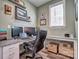Home office featuring a built-in desk, neutral paint, floating shelves, and a window with natural light at 5050 Watersail Way, Lake Wylie, SC 29710