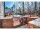 Stylish outdoor kitchen featuring a stainless steel grill, granite countertops, and a built-in refrigerator, perfect for entertaining at 5050 Watersail Way, Lake Wylie, SC 29710