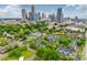 Daytime aerial view of the property showcasing the landscape and the downtown skyline at 509 N Graham St # 2D, Charlotte, NC 28202