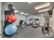 Community fitness center equipped with treadmills, exercise bike, weights, and ample natural light at 509 N Graham St # 2D, Charlotte, NC 28202