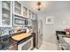 Well-equipped kitchen with stainless steel appliances, granite counters, and tile backsplash at 509 N Graham St # 2D, Charlotte, NC 28202