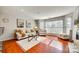 Spacious living room with large windows and a decorative fireplace at 509 N Graham St # 2D, Charlotte, NC 28202