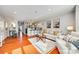 Bright open-concept living room featuring hardwood floors, modern furnishings and access to the kitchen at 509 N Graham St # 2D, Charlotte, NC 28202
