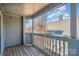 Balcony with wood flooring and views of the city at 525 N Graham St # 3B, Charlotte, NC 28202