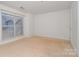 Bedroom featuring a large window and neutral carpet at 525 N Graham St # 3B, Charlotte, NC 28202