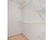 White closet with wire shelving and neutral carpet at 525 N Graham St # 3B, Charlotte, NC 28202