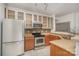 The kitchen features granite countertops, stainless steel appliances, and light wood cabinets at 525 N Graham St # 3B, Charlotte, NC 28202
