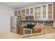 This modern kitchen features stainless steel appliances, granite countertops, and glass-front cabinets at 525 N Graham St # 3B, Charlotte, NC 28202