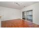 Spacious living room has hardwood floors and sliding glass doors leading to a balcony at 525 N Graham St # 3B, Charlotte, NC 28202