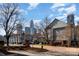 Street view of homes with the city skyline in the background at 525 N Graham St # 3B, Charlotte, NC 28202