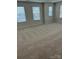 Spacious bedroom with natural light through large windows and plush carpeting at 5337 Orchid Bloom Dr, Indian Land, SC 29707