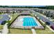 Aerial view of the community pool with lounge chairs and shade; a great neighborhood amenity at 5337 Orchid Bloom Dr, Indian Land, SC 29707