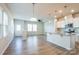 Bright, open-concept living space featuring kitchen with island and stainless appliances at 5337 Orchid Bloom Dr, Indian Land, SC 29707