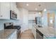 Well-equipped kitchen features stainless appliances, granite countertops, and ample cabinet space at 5337 Orchid Bloom Dr, Indian Land, SC 29707