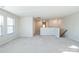 Upstairs loft area with plush carpeting and abundant natural light from a window at 5337 Orchid Bloom Dr, Indian Land, SC 29707