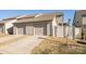 Detached two-car garage with driveway, fence and exterior siding, providing ample parking and storage space at 5337 Orchid Bloom Dr, Indian Land, SC 29707